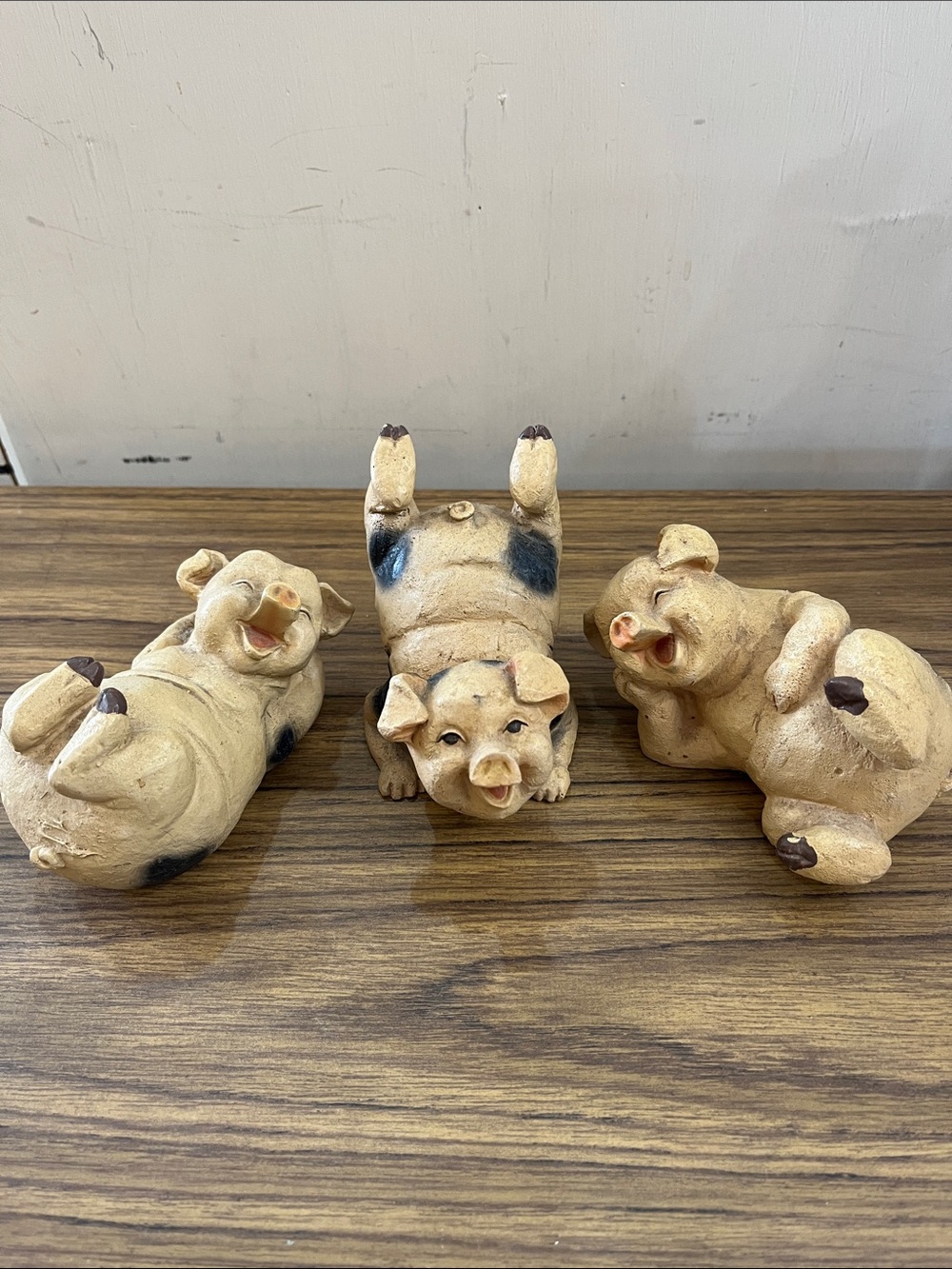 Set of three frolicking pigs